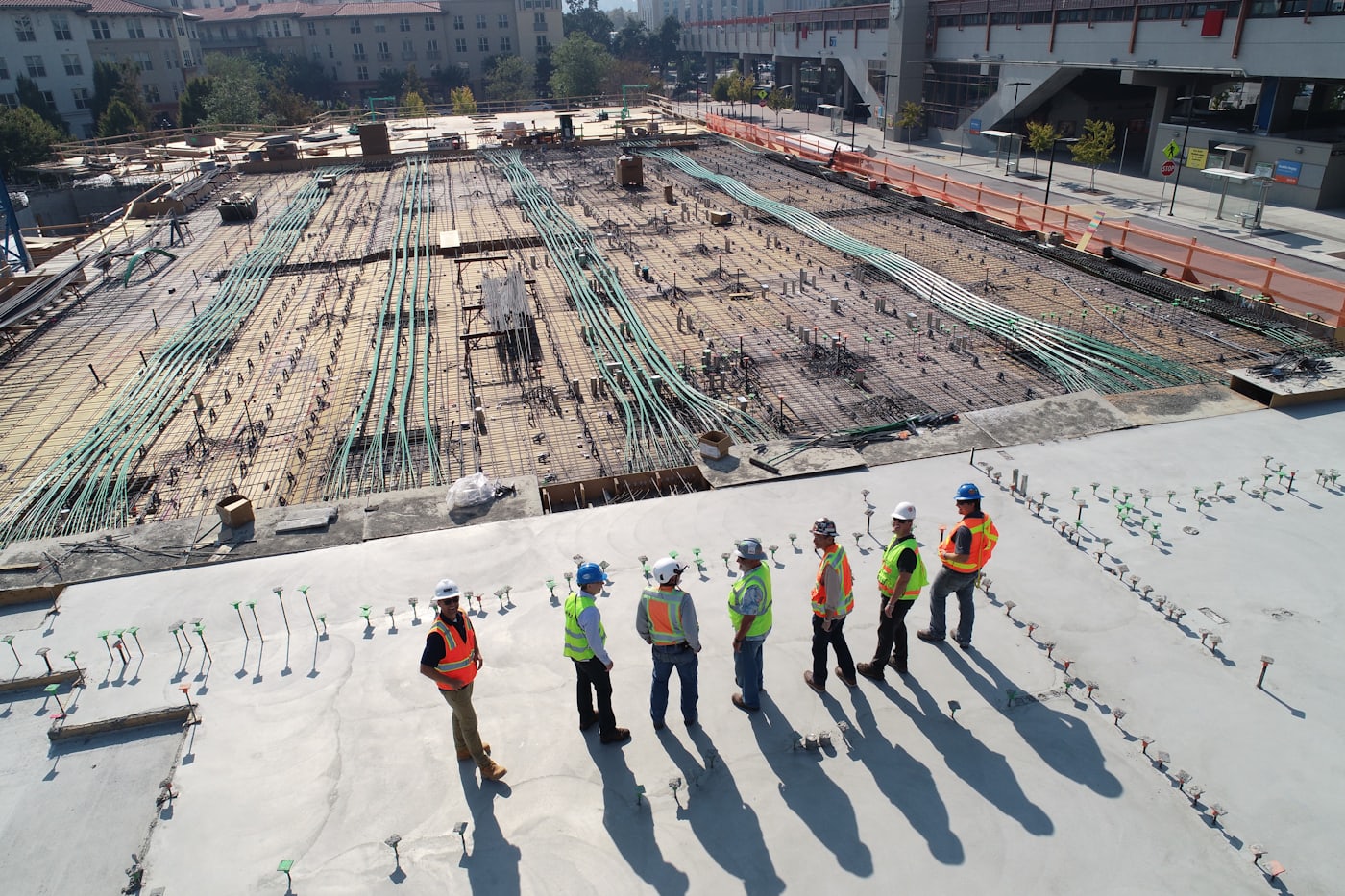 Precision groundworks on an active building site
