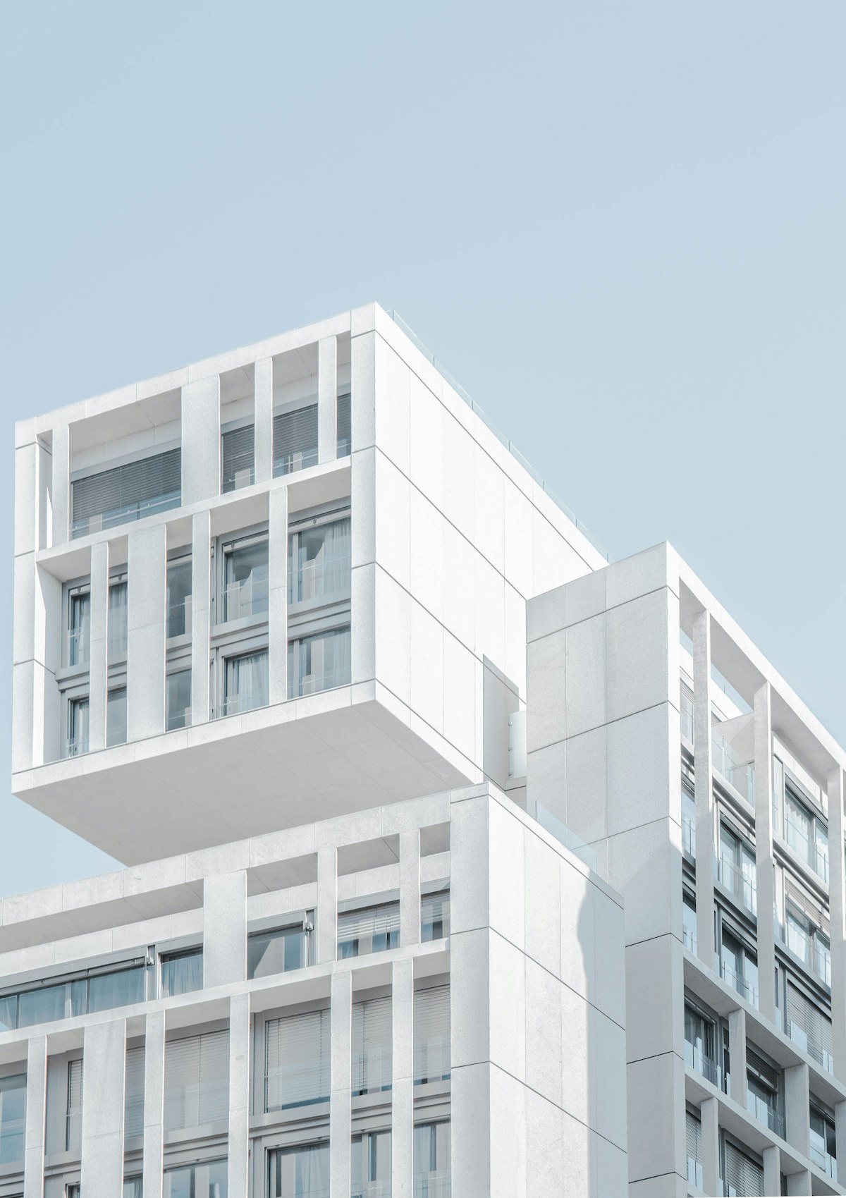 Minimalist white villa with sharp shadow lines